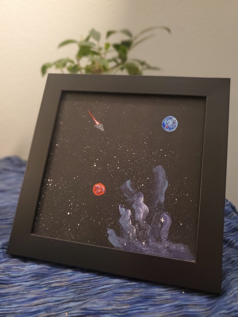 A painting of space, photographed in front of a plant.