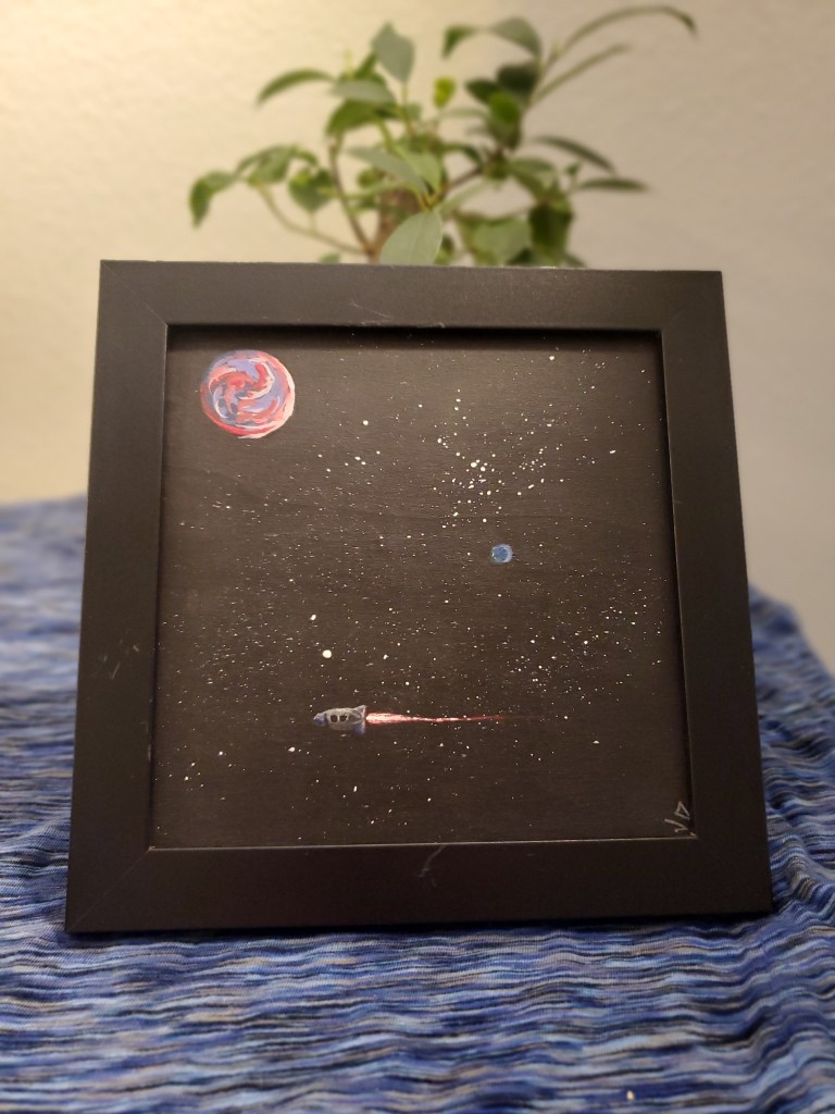 A painting of space, photographed in front of a plant.